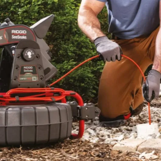 Exterior drainage inspection in progress