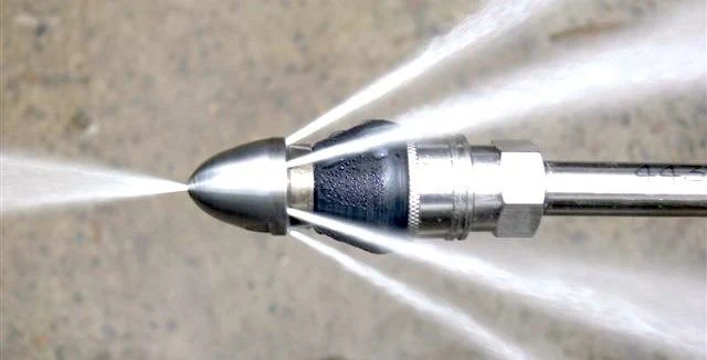 Hydro jetting nozzle that can help remove grease buildup contributing to slow kitchen sink drainage