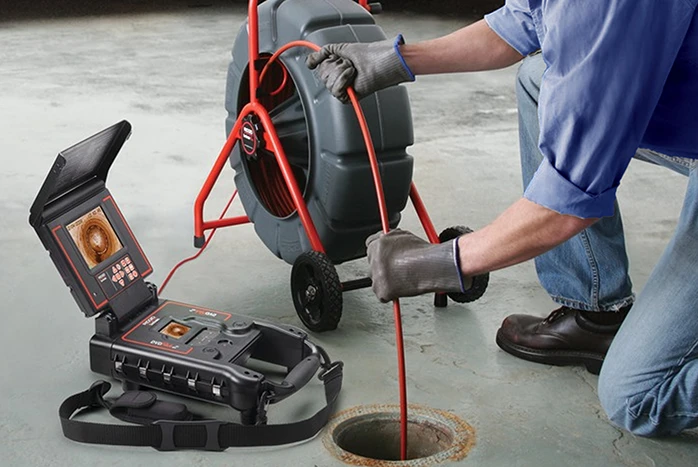 Sewer camera inspection being performed inside a residential sewer line